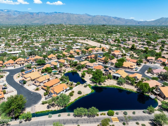 birds eye view of property featuring a water and mountain view