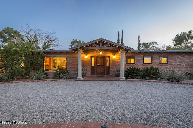 view of front of house featuring brick siding