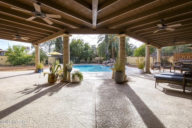 view of swimming pool featuring a fenced backyard, a ceiling fan, a fenced in pool, and a patio