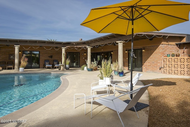 outdoor pool featuring a patio area