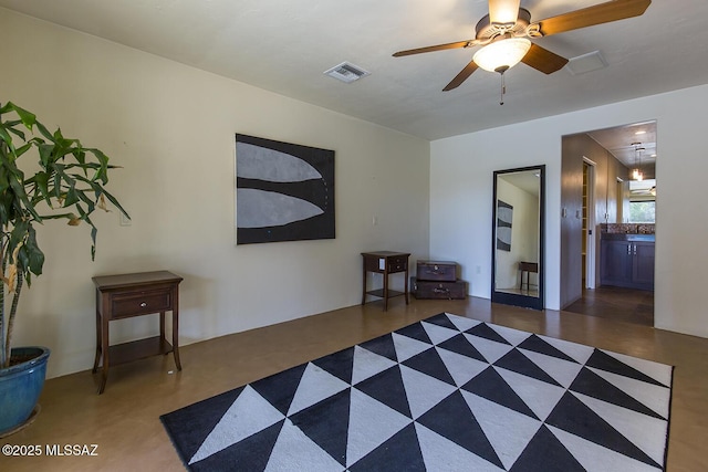 unfurnished room featuring a ceiling fan and visible vents