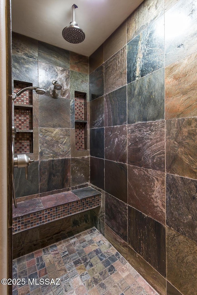 bathroom featuring a tile shower