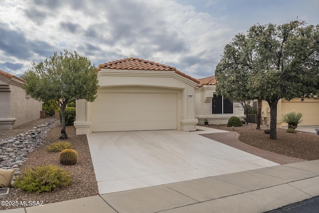 mediterranean / spanish-style home with a garage