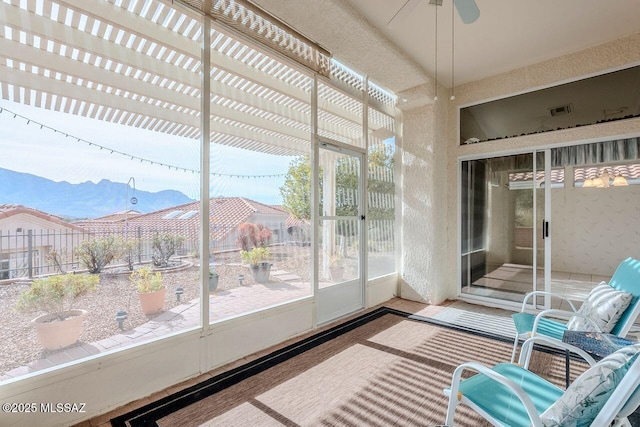 sunroom / solarium with ceiling fan