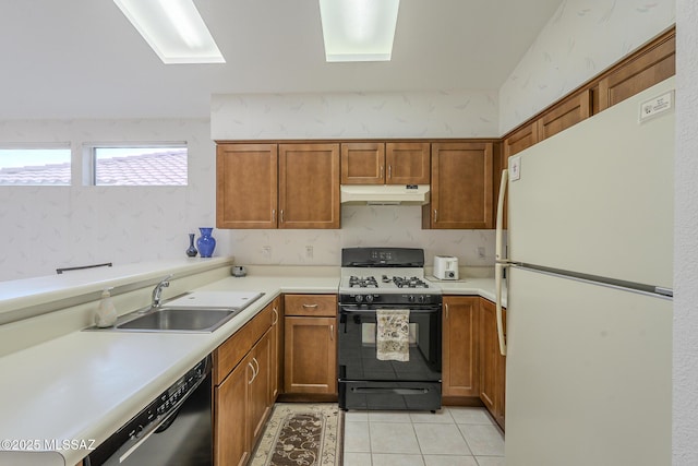 kitchen with light tile patterned flooring, black dishwasher, sink, white refrigerator, and gas range oven