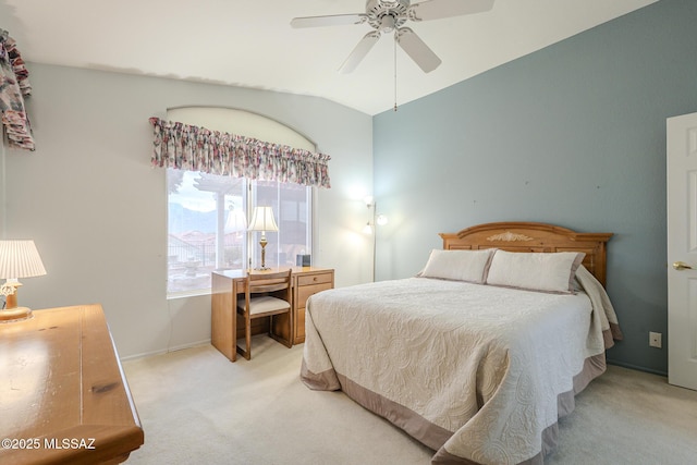 carpeted bedroom featuring lofted ceiling and ceiling fan