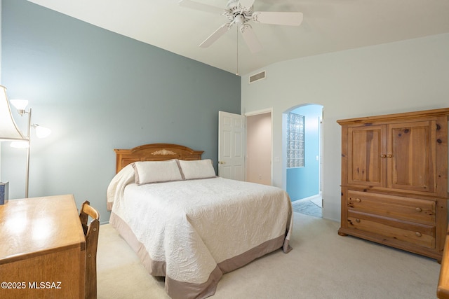 carpeted bedroom featuring vaulted ceiling and ceiling fan