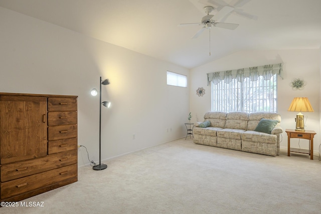 carpeted living room featuring vaulted ceiling and ceiling fan