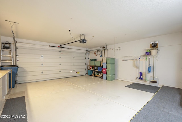 garage featuring a garage door opener