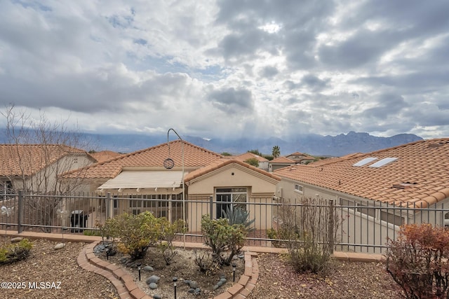 rear view of house with a mountain view