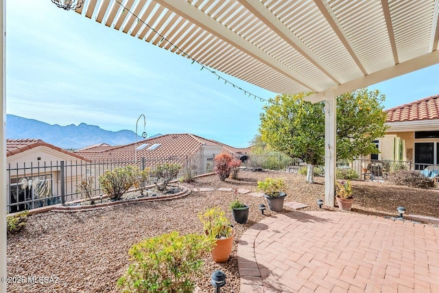 view of patio featuring a mountain view and a pergola