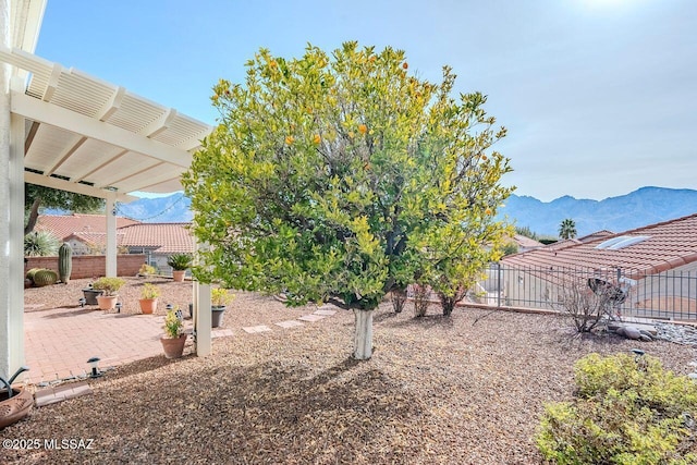 view of yard with a mountain view, a pergola, and a patio area