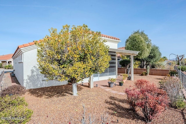 back of house with a pergola