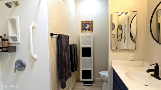 449 W San Ignacio, Green Valley, AZ 85614 - bathroom featuring toilet, vanity, and wood finished floors
