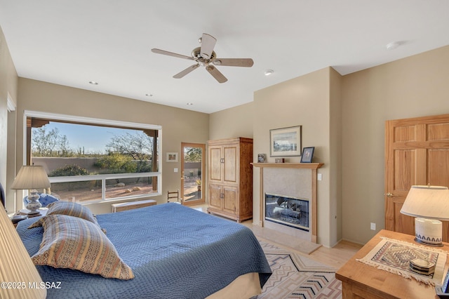 bedroom with light hardwood / wood-style flooring and ceiling fan