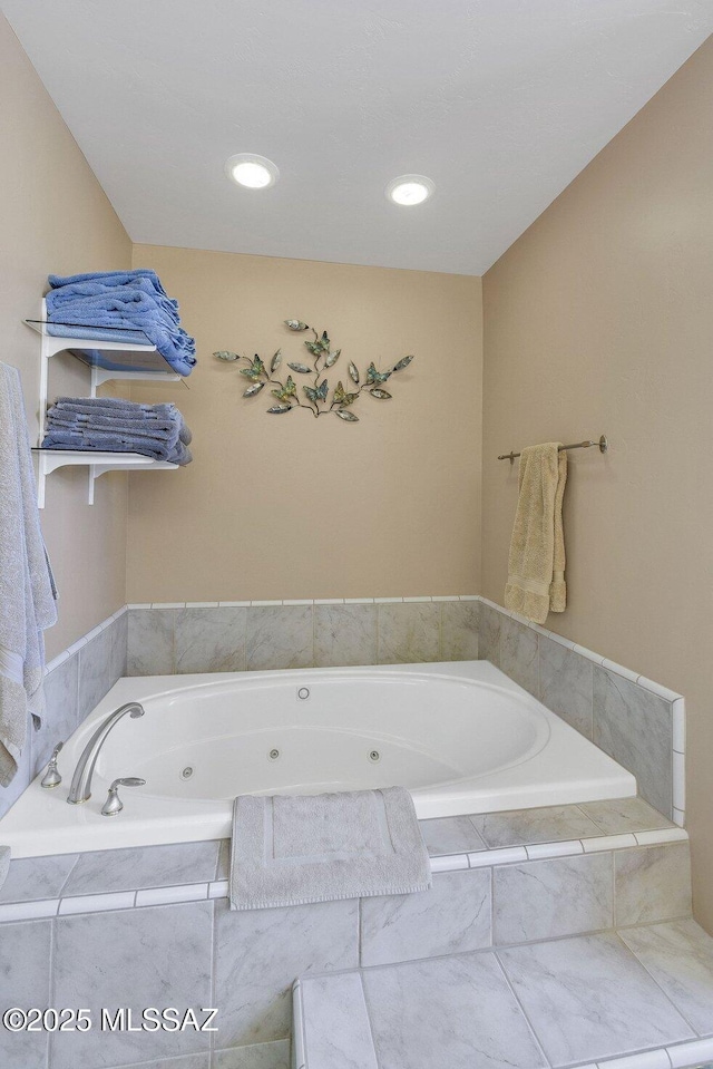 bathroom with tiled tub