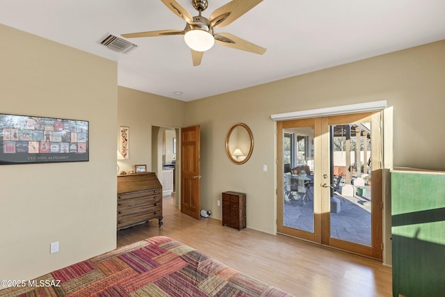 bedroom with french doors, ceiling fan, wood-type flooring, and access to outside