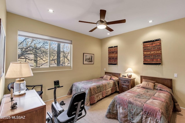 carpeted bedroom featuring ceiling fan