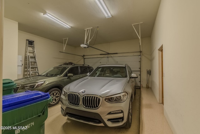 garage featuring a garage door opener