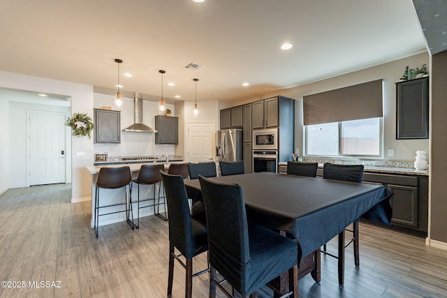 dining area with light wood-type flooring