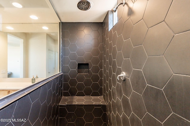 bathroom featuring tile walls and tiled shower