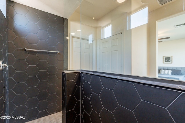 bathroom featuring tile walls and walk in shower