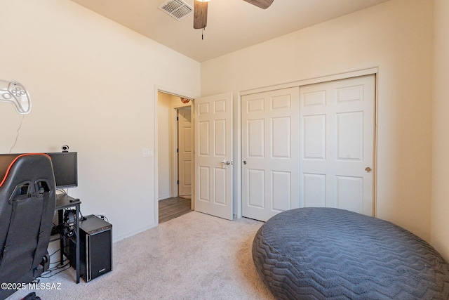 office area with ceiling fan and light carpet