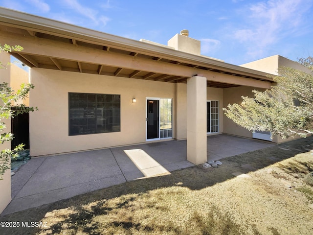 back of house featuring a patio area