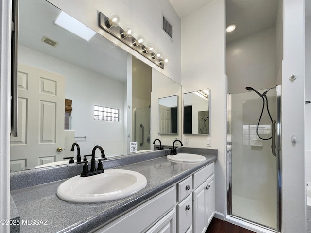 bathroom featuring vanity and walk in shower