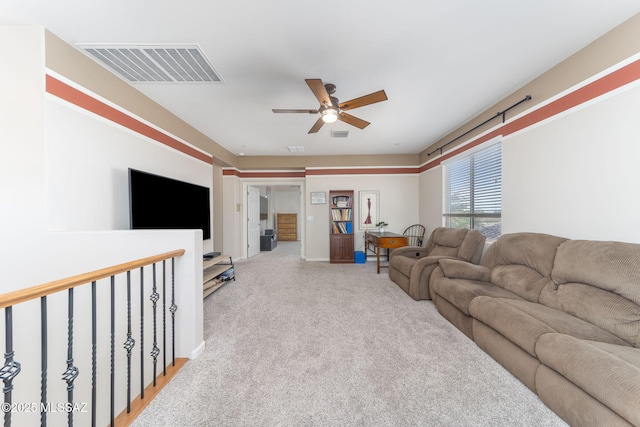 carpeted living room featuring ceiling fan