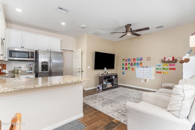 living room with ceiling fan