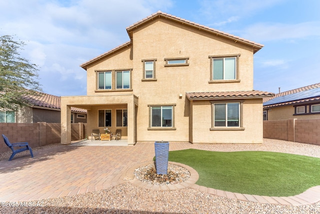 rear view of property with a patio area