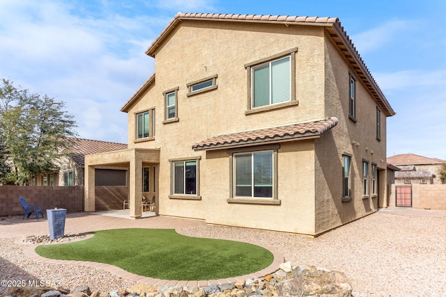 back of house with a patio area