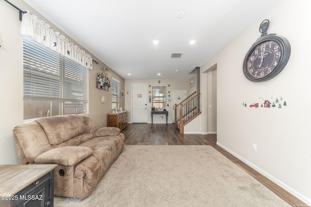 living room with dark hardwood / wood-style flooring