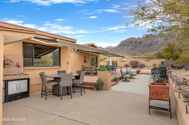 view of patio / terrace with a mountain view