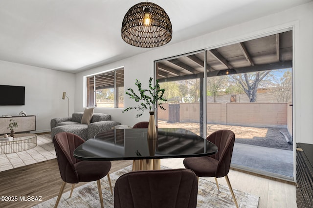 dining space featuring a chandelier and wood finished floors