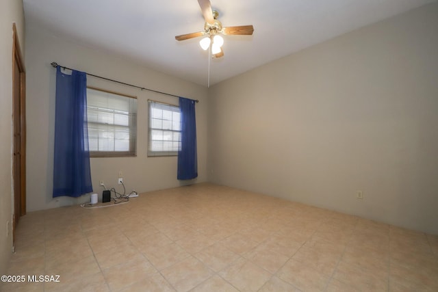 spare room with ceiling fan