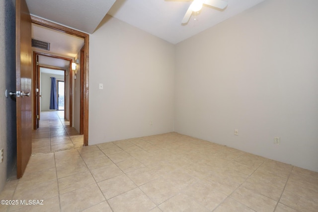 unfurnished room featuring ceiling fan and light tile patterned floors