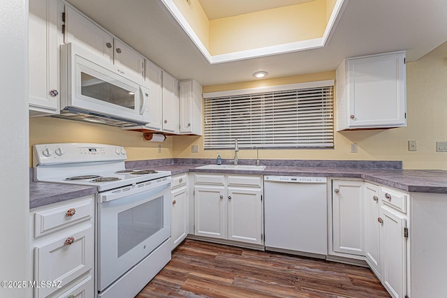 kitchen with white cabinetry, white appliances, dark wood-type flooring, and sink