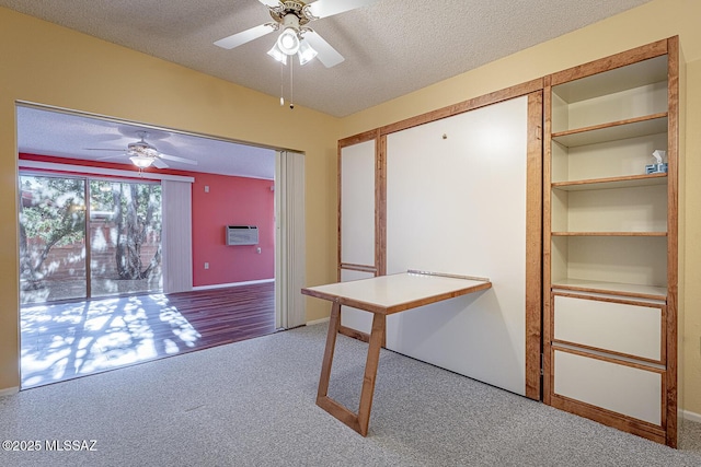 interior space with ceiling fan and a textured ceiling