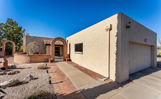 southwest-style home with a garage