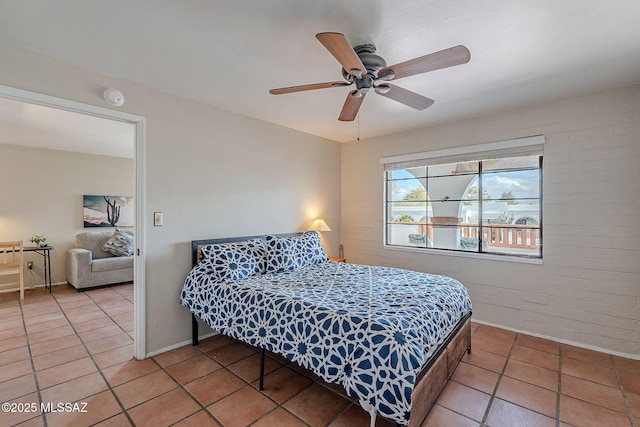 bedroom featuring tile patterned flooring and ceiling fan