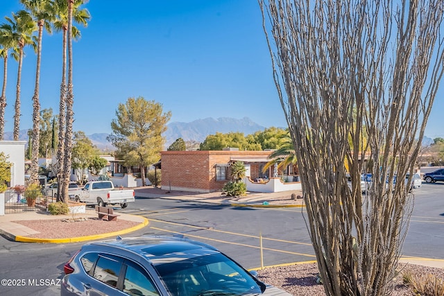 view of front of property with a mountain view