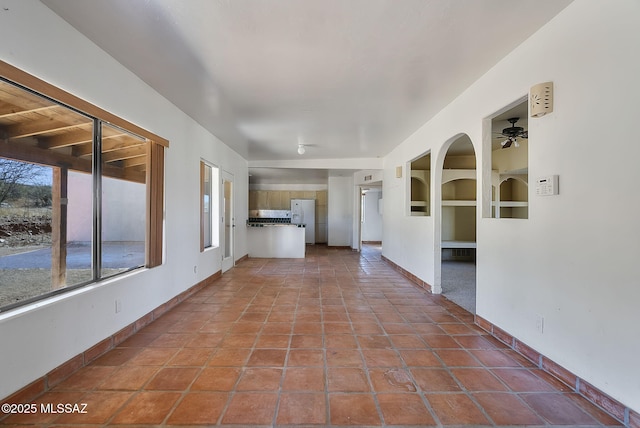 hall featuring tile patterned flooring