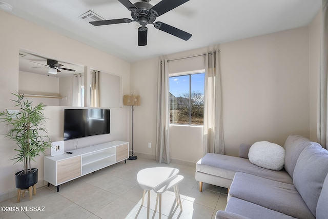 tiled living room featuring ceiling fan