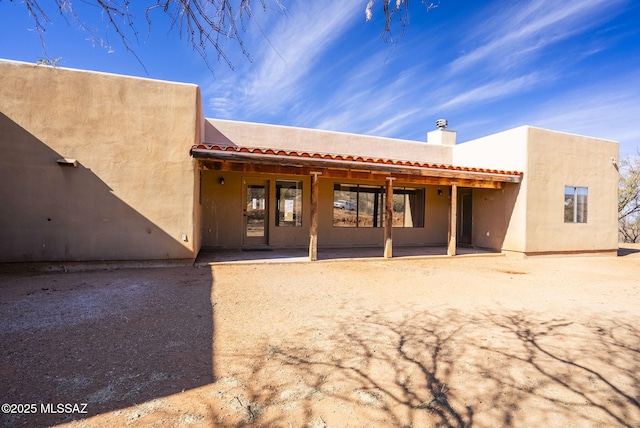 rear view of house with a patio area