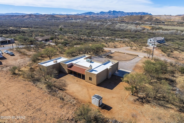 drone / aerial view featuring a mountain view