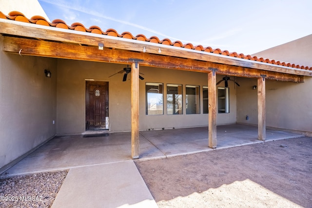 view of patio featuring ceiling fan