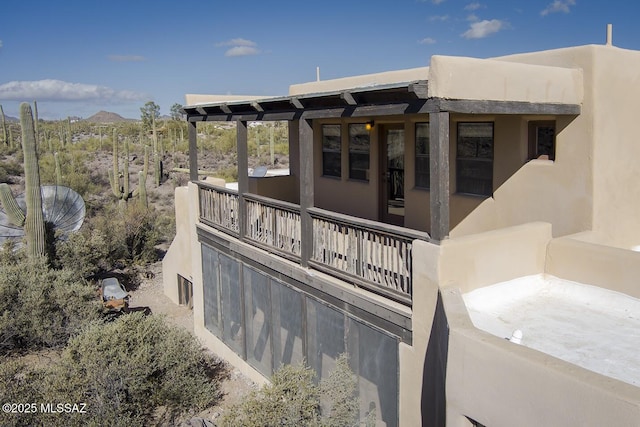 exterior space featuring a mountain view and a balcony