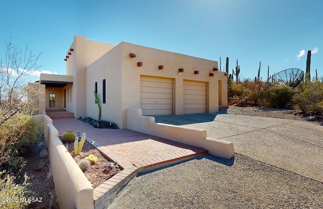 view of side of property featuring a garage